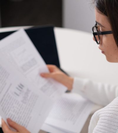 Businesswoman analyzing company financial data or statistical results using laptop. Financial analyst prepares annual report