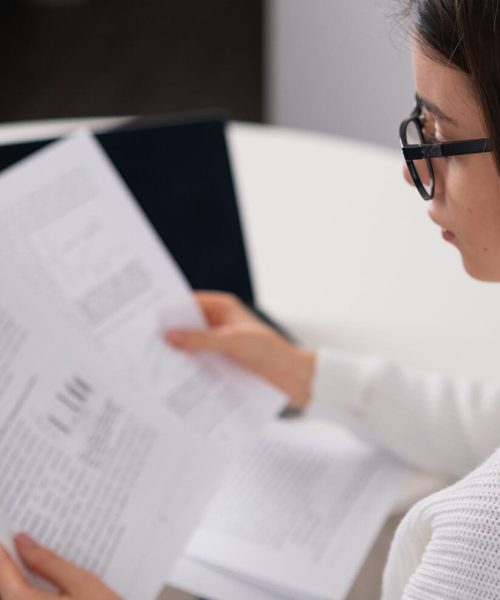 Businesswoman analyzing company financial data or statistical results using laptop. Financial analyst prepares annual report