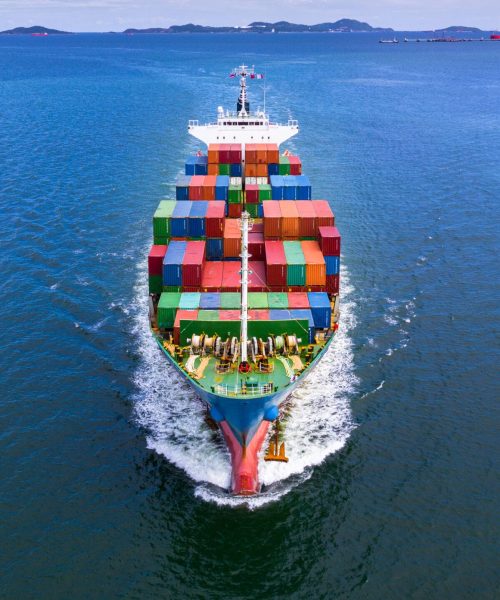Aerial view container ship carrying container in import export business logistic and transportation of international by container ship in the open sea.