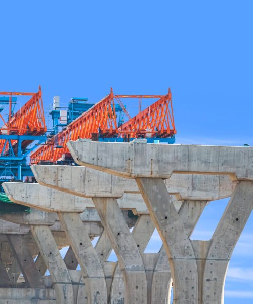 Launching Gantry For Installing Concrete Segment J 2025 03 10 22 49 33 Utc Launching gantry Structure for installing concrete Segment Joint on foundation of Flyover Expressway in road Construction site against blue sky background