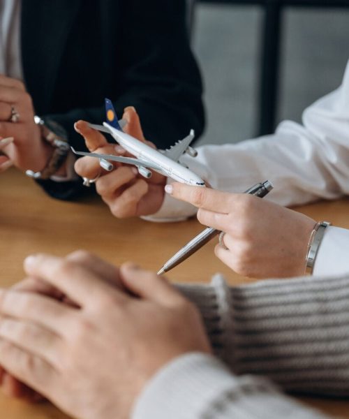 Travel conception. Close up view of people in airline company.