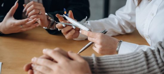 Travel conception. Close up view of people in airline company.